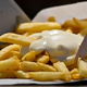 Fries with a mayo-based sauce on top